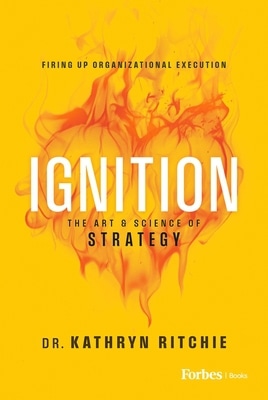 Yellow book cover featuring a fiery abstract background with the bold white title 'IGNITION'; subtitle 'The Art & Science of Strategy' and author 'Dr. Kathryn Ritchie' with forbes book publishers.com logo at the bottom right.